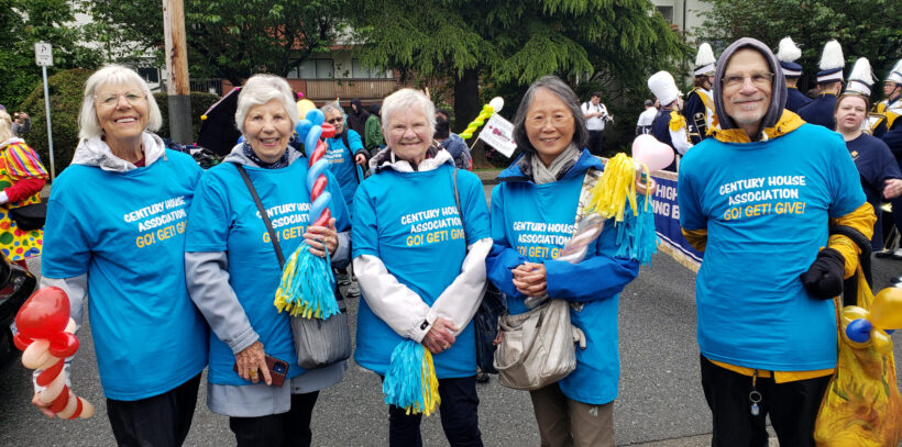 Hyack parade volunteer walkers in blue t-shirts